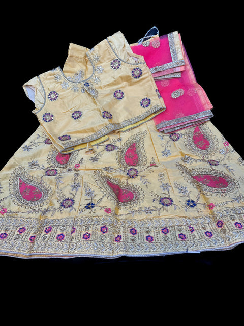 Yellow colour silk based embroidered lehnga with contrast netting dupatta