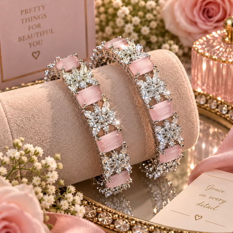 Soft pink stones and sparkling American Diamond floral details give these silver-tone bangles an elegant party look. Perfect for weddings and festive occaOne set includes 2 bangles. Price is per set(Slight variations in color & design is possible )