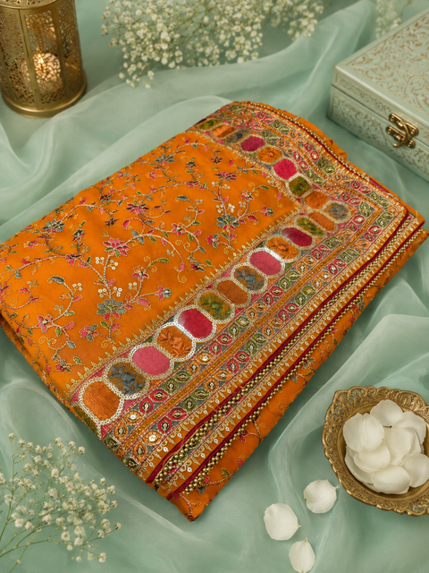 Premium Georgette Saree adorned with vibrant multicolor embroidery and sequin work, finished with a beautifully detailed border. Model blouse is for reference only; blouse piece is attached with the saree. Slight variation in color and design may occur.