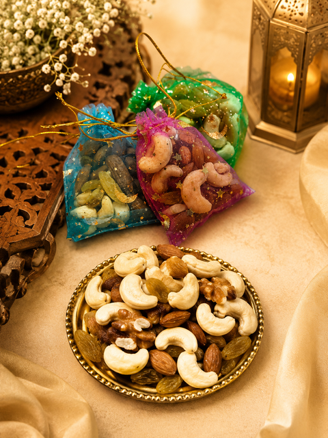 Premium Dry Fruit Bag – A delicious mix of premium cashews, almonds, walnuts, and raisins, beautifully packed in a festive organza gift bag. Price is per bag