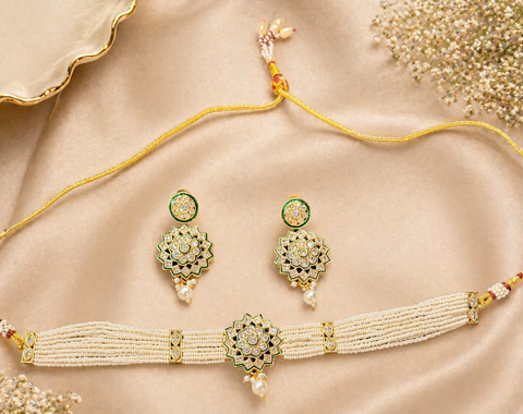 Elegant pearl choker set featuring intricate gold detailing and a statement original kundan-style centerpiece, paired with matching earrings for a timeless look.Perfect blend of tradition and sophistication