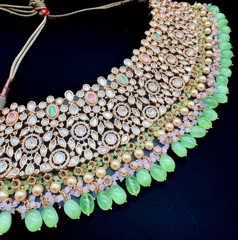 (video clip attached)Pastel Pink & Mint color Original American Diamond stones with Polki & pearls studded very Heavy work necklace with beautiful Jhumka, tikka NOTE:- original AD & Polki stones not fake plastic stones)