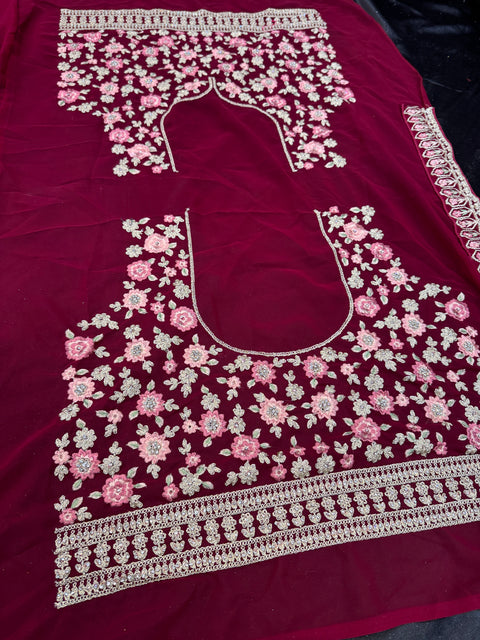 Maroon  colour Georgette based heavy embroidery work with stone work multiflared beautiful bridal lehnga with attached latkans And exact embroidery Potli Bag
