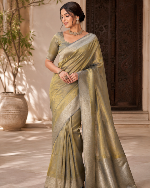 Soft Silk Tissue Saree with Dual Tone Metallic Finish .Model-worn blouse is for reference only. Unstitched blouse piece is attached with saree(slight variation in color & design is possible)