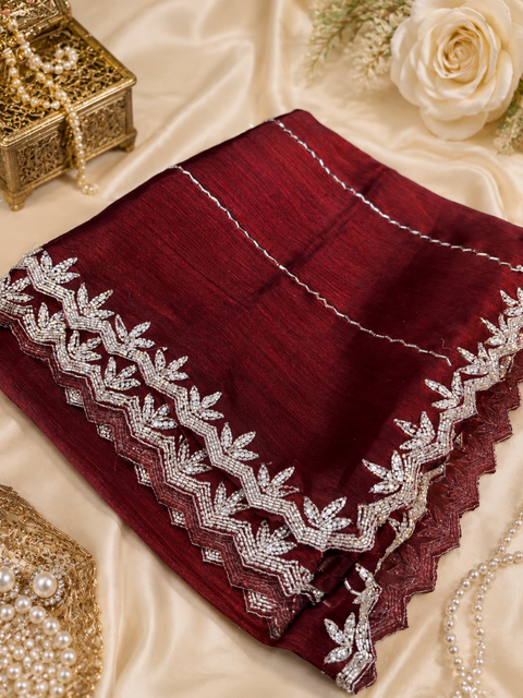 Elegant Jimmy Choo Saree featuring intricate handwork detailing and a beautifully embellished border. Comes with an attached matching blouse piece, blouse worn by the model is for reference purposes only(slight variation in color and design is possible)