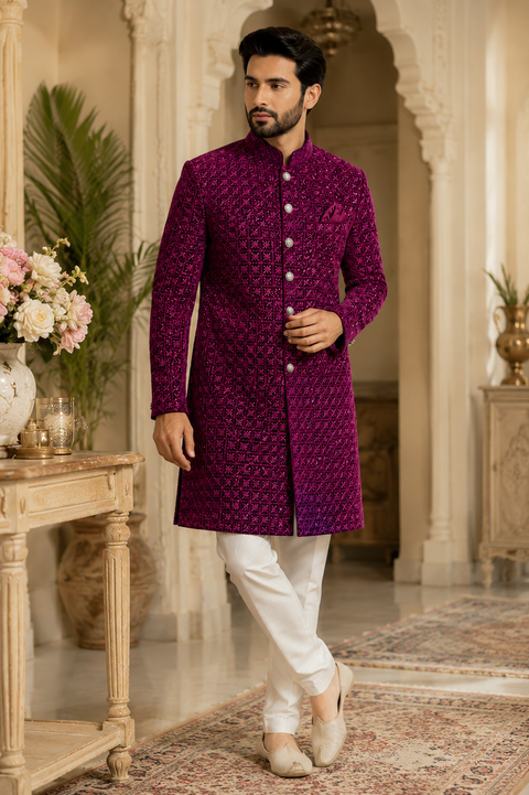 Luxurious Purple Wine sequin embroidered sherwani with intricate geometric detailing, crafted for a bold and sophisticated wedding celebration look. Slight variation in color and design may occur.