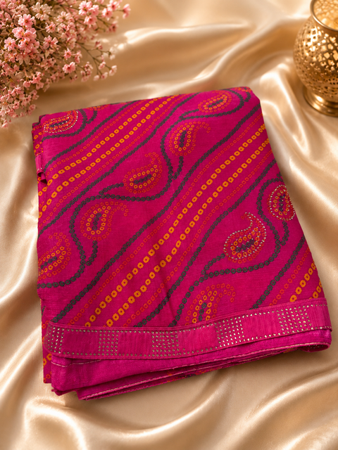 Soft georgette based bandhani print sarees with stones work border. Blouse Worn By The Model Is For Reference Purposes Only. The Blouse Piece Is Attached Separately With The Saree. Slight Variation In Color And Design May occur