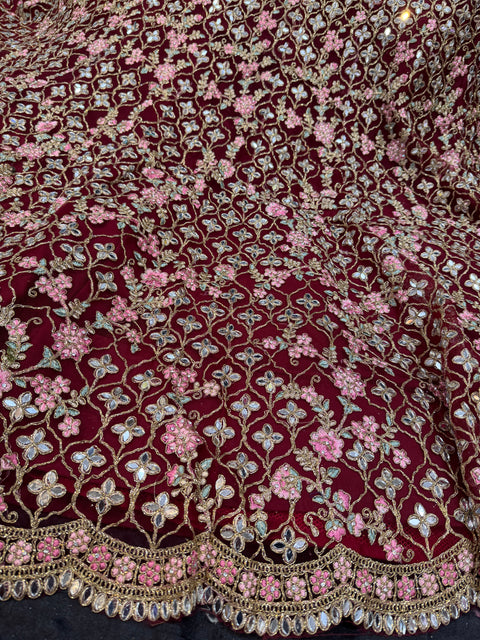 Deep Maroon colour netting based heavy embroidery jaal with mirror work multiflared beautiful bridal lehnga
