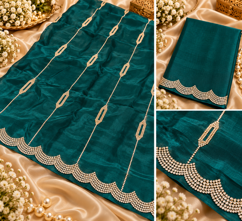 Soft Shiny Georgette Saree with a beautiful flowy drape, elegant stonework lines and a rich scalloped stone border. Attached blouse piece included; model blouse is for reference only. Slight variation in colour and design is possible.