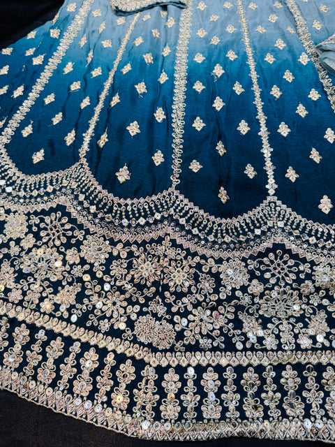 Chinnon based embroidery with mirror work designer blouse with ombré tone lehnga and netting based sequined work dupatta