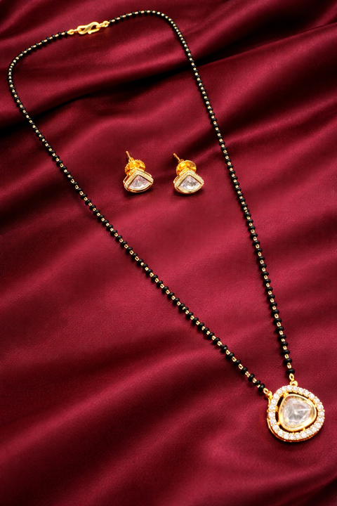 Golden Stone & Jerkan Gold Plated (Artificial) Mangalsutra With Artificial Black Beads Chain, and matching small studs Apx Size: 20-22cm