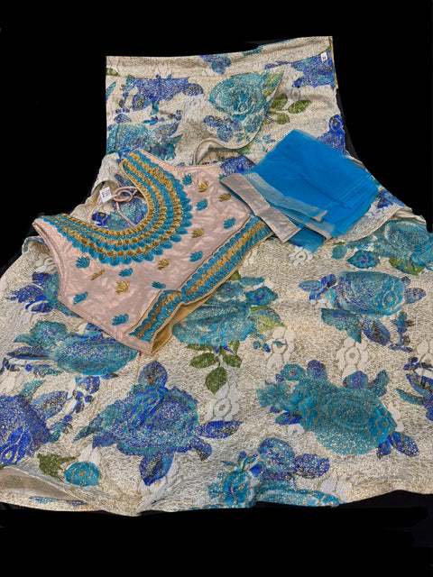 Golden silk based embroidery & stone work blouse with golden cream colour printed shimmery silk lehnga with dupatta