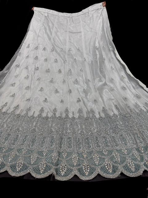 Netting based silver stones and embroidery work all over front & back of kameez with stone work and beautiful lehnga & netting dupatta (Size 44 and can be altered upto 46)