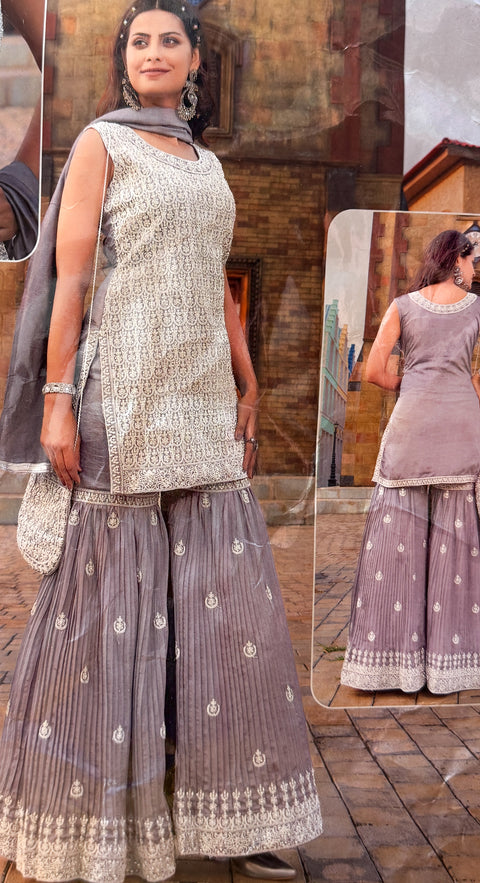 Georgette Based embroidery Work With Sequins Work kameez and sharara with dupatta & matching Potli bag