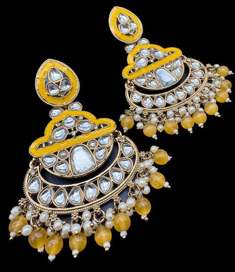 Kundan with beautiful pearls Earrings (slight variations in color and design is possible)