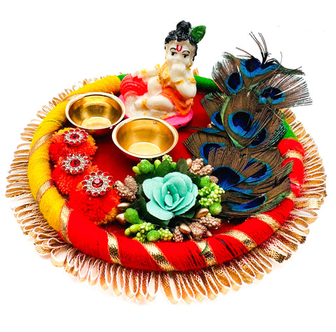 Beautiful Krishna Murti decorated in plate with peacock feather and Jyoti stand attached