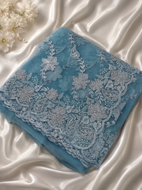 Aqua Blue color Net Saree Adorned With Intricate Embroidery, stonework  Detailing & Beautiful Border. The Blouse Worn By The Model Is For Reference Purposes Only. The Actual Blouse Piece Comes Attached With Saree(Slight Variations Are Possible)