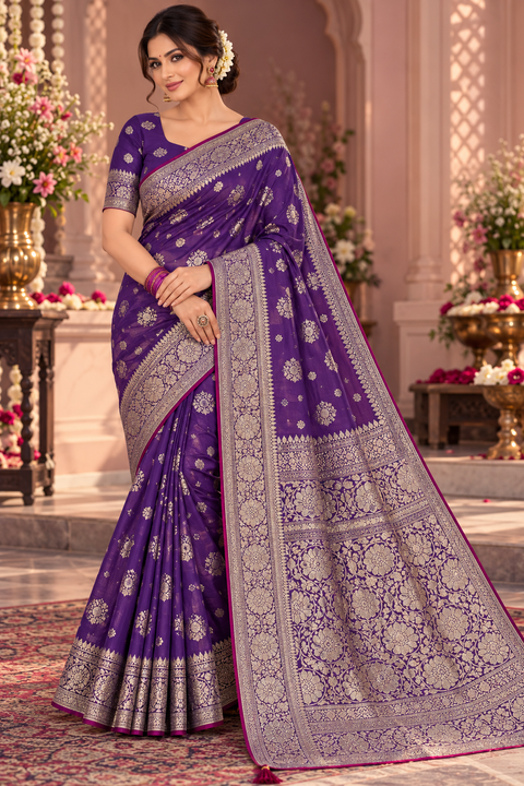 Luxuriously soft silk saree with a smooth, lightweight feel and beautifully flowy drape. Featuring rich woven zari floral motifs and an elegant detailed border .Blouse piece included. Slight variation in colour and design is possible.