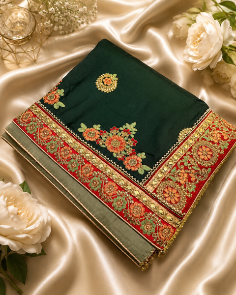 Elegant dual-tone saree featuring a rich embroidered border and intricate floral motifs.The blouse worn by the model is for reference purposes only. The blouse piece is attached separately with the saree. Slight variation in color and design may occur.