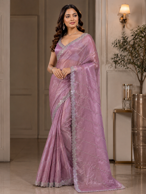 Elegant Jimmy Choo Saree featuring intricate handwork detailing and a beautifully embellished border. Comes with an attached matching blouse piece, blouse worn by the model is for reference purposes only(slight variation in color and design is possible)