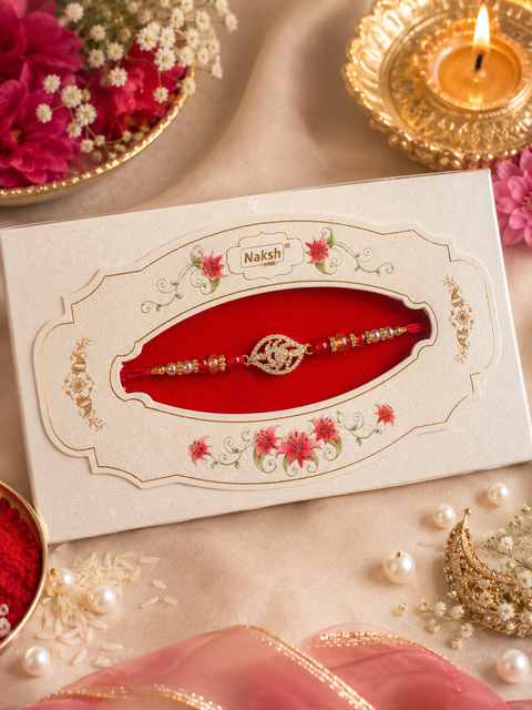 American Diamond Stylish stone designer Rakhi with pearl detailing, presented in a premium gift box
