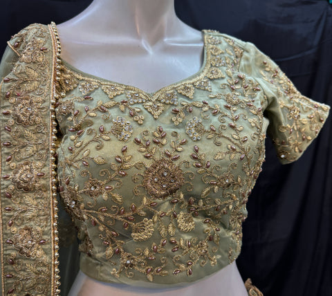 (Video clip attached)SIZE 42 (Upto 46))Lite Mint colour netting Based Beautiful Embroidery Work With Golden Fine Stones& beaded pearl work Very Heavy Layered Designer semi/Bridal Lehnga With Heavy Tessels Attached To Blouse & Lehnga