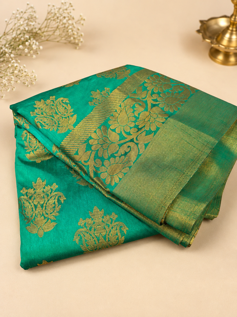 Graceful Cotton Silk Saree featuring elegant zari weaving, a rich texture, and a structured drape . Attached Blouse Piece Included. Slight Variation In Colour And Design May Occur.