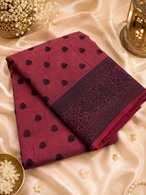 Beautiful semi-silk cotton saree with an elegant woven border and classic motifs. Attached blouse piece included. Slight variation in colour and design may occur.