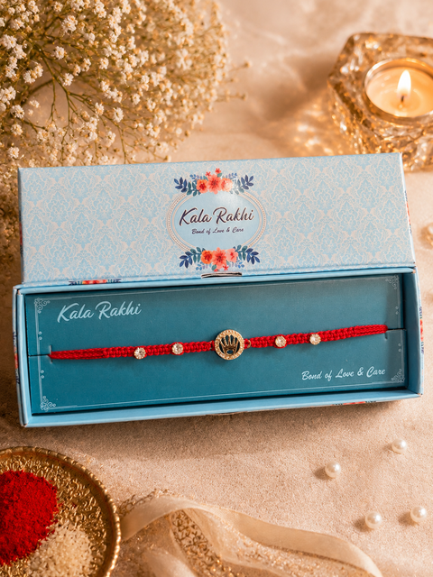 Stylish stone designer Rakhi with pearl detailing, presented in a premium gift box
