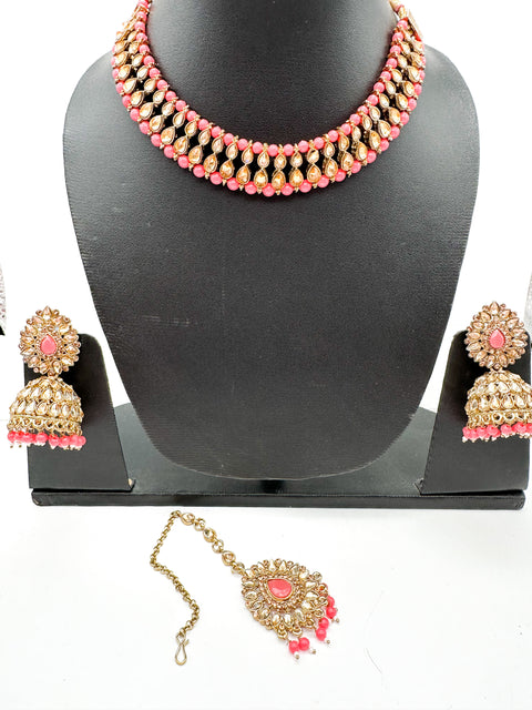 Golden stone with pearls studded simple Necklace with beautiful Jhumka & Tikka set