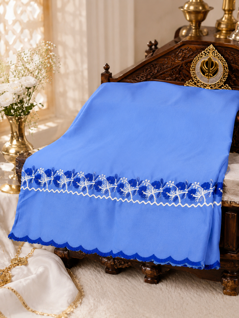 Elegant Hazoori Saropa crafted in rich light blue fabric, adorned with traditional white and blue embroidery and a delicate scalloped border.Size (around 216cms lenth / 84 cms wide)