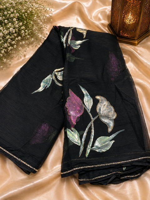 Soft Chiffon Saree with all-over shimmery floral print and delicate handwork detailing. Lightweight, soft and beautifully draping. Blouse piece attached; model blouse is for reference only. Slight variation in colour and design is possible.