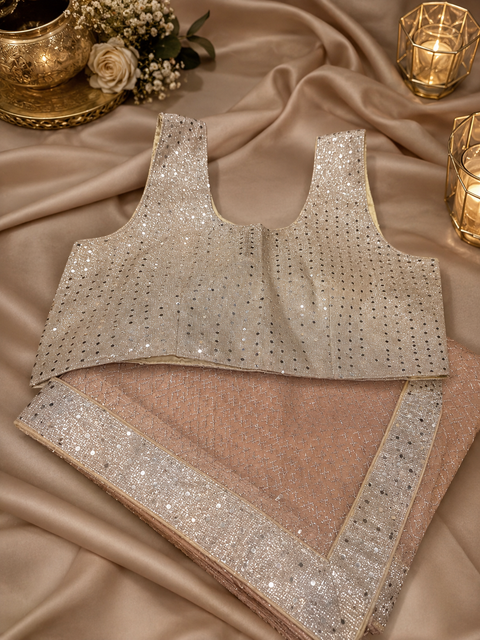 Shimmering saree featuring an all-over sparkle weave and dazzling sequin border, paired with a matching glitter blouse for an effortlessly glamorous party look(size 38-40 )slight variation in color and design is possible)