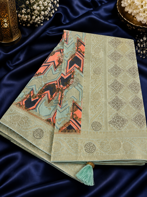 Soft Banarasi Silk brocade saree with stone work and tessels attach on Pallu Model-Worn Blouse Is For Reference Only. Unstitched Blouse Piece Is Attached With Saree(Slight Variation In Color & Design Is Possible)