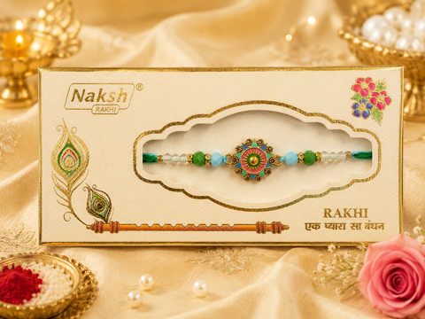 Elegant handcrafted Rakhi with premium beads and sparkling stonework, beautifully crafted to celebrate the special bond of love and protection.