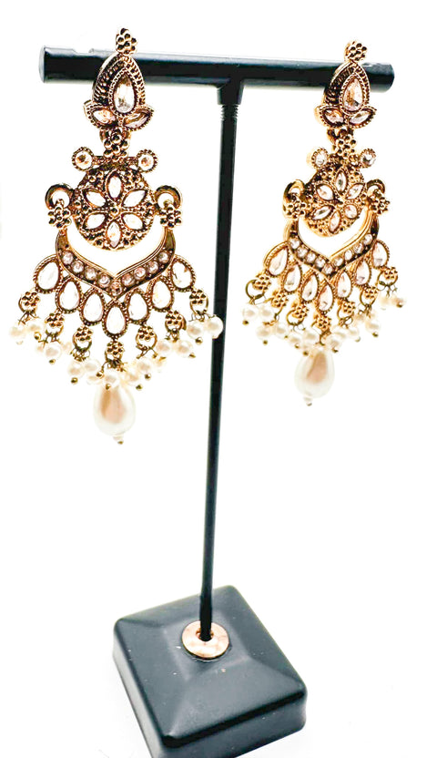 Golden polki stone with pearls work beautiful earrings