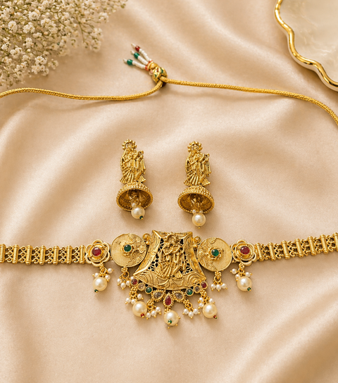 Beautiful Radha Krishna design Elegant gold temple-style choker with intricate deity detailing and pearl drop