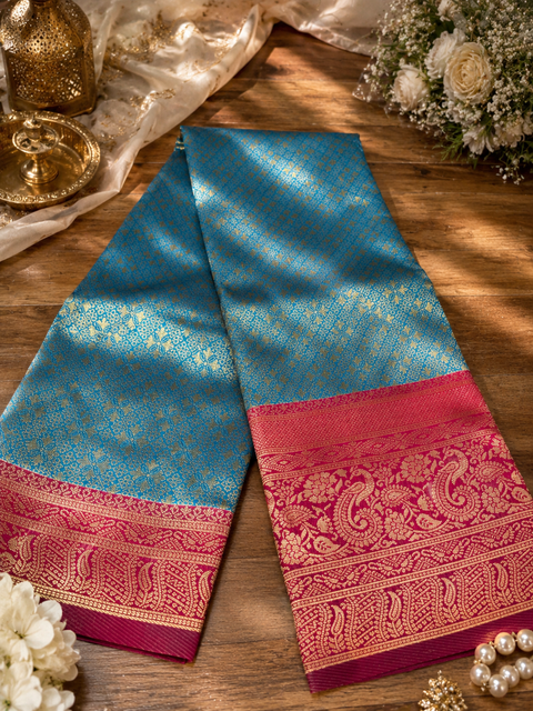 Premium soft Silk Saree with rich zari weaving and contrast woven pallu. featuring elegant dual-tone shades.Model-worn blouse is for reference only. Unstitched blouse piece is attached with saree(slight variation in color & design is possible)