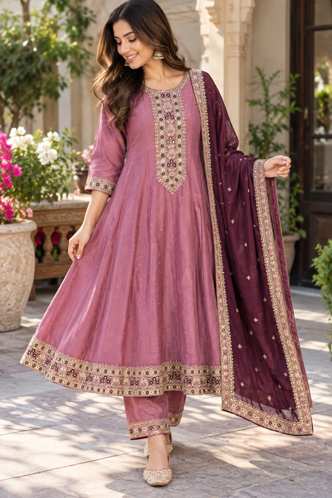 Rayon Silk/Georgette Silk Anarkali Suit featuring beautiful embroidery on the neckline and kurta, with a soft flattering flare & matching pants and a Chinon dupatta finished with elegant embroidery.Slight variation in colour and design is possible