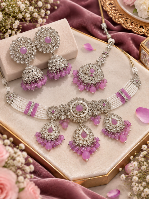 Beautiful polki & jerkan stones with pearls and colorful stones choker necklace & Jhumka with Tikka. Slight variations in colour and design are possible.