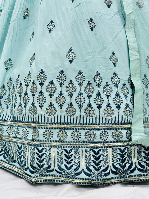 Embroidery with Mirror work silk based designer blouse with heavy flared printed  ken ken lehnga with tessels attached and netting dupatta with lace border and tessels