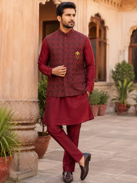 Rich maroon jacquard waistcoat set with a matching kurta and straight pants, designed for a timeless festive and wedding look.