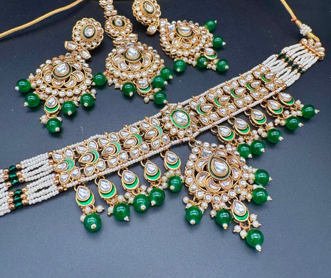 Beautiful Kundan and pearls work classy choker set with beautiful earrings & Tikka