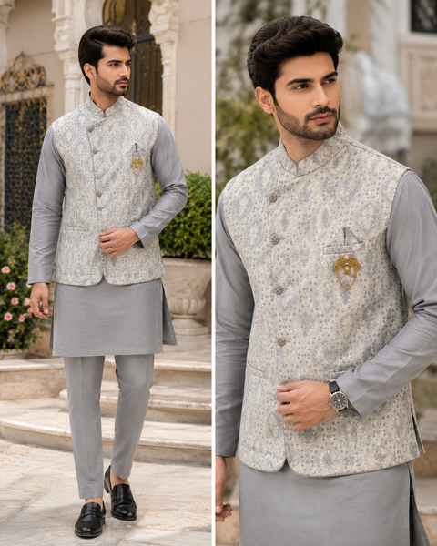 Elegant grey kurta set paired with a premium woven jacket, designed for a sophisticated festive and wedding-ready look. Slight variation in color and design may occur.