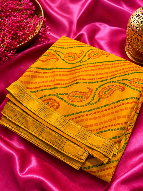 Soft georgette based bandhani print sarees with stones work border. Blouse Worn By The Model Is For Reference Purposes Only. The Blouse Piece Is Attached Separately With The Saree. Slight Variation In Color And Design May occur