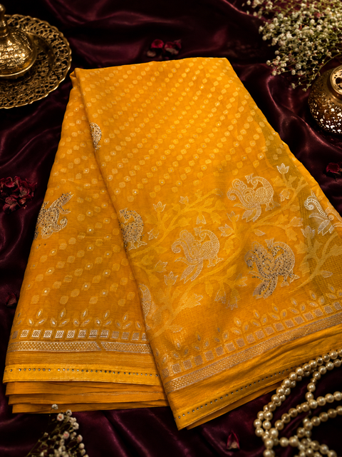 Elegant Tissue/Georgette Blend Saree featuring woven zari motifs(Comes with a matching blouse piece; the blouse worn by the model is for reference purposes only. Slight variation in color and design is possible)