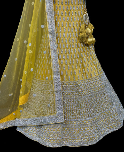 (Video clip attached)SIZE 42 (Upto 46))Lite Mint colour netting Based Beautiful Embroidery Work With Golden Fine Stones& beaded pearl work Very Heavy Layered Designer semi/Bridal Lehnga With Heavy Tessels Attached To Blouse & Lehnga