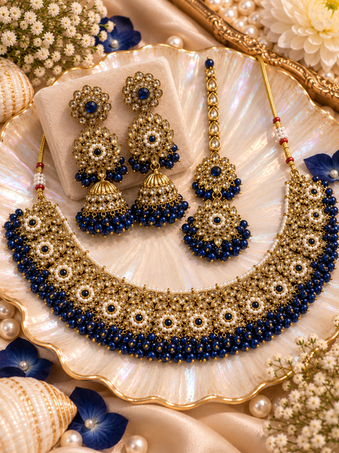 Beautifully crafted with sparkling golden stones, Polki-look stones, and colourful beads. Slight variations in colour and design are possible.