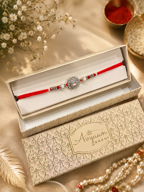 American Diamond Stylish stone designer Rakhi with pearl detailing, presented in a premium gift box
