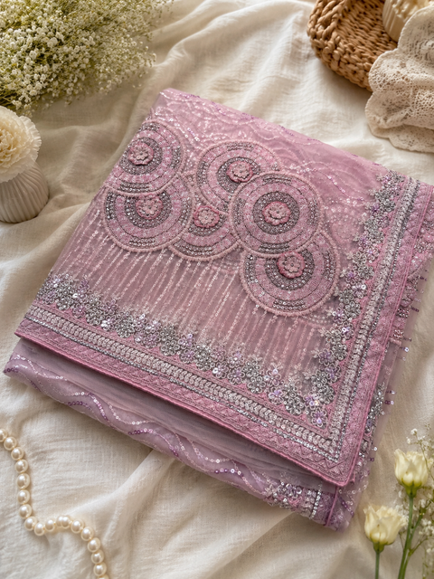 Heavy work designer Saree with netting base fabric and stones work design all over with heavy embroidery .The Blouse Worn By The Model Is For Reference Purposes Only. The Actual Blouse Piece Comes Attached With Saree(Slight Variations Are Possible)